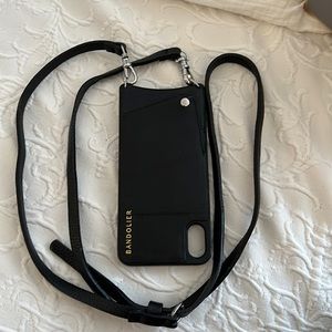 Bandolier, black pebbled leather. Fits iPhone 11 Pro Max. Silver toned hardware.